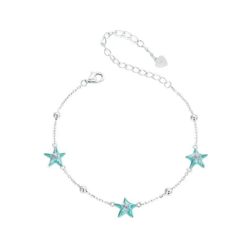Pulseras de eslabones con estrellas de mar en degradado azul verdoso